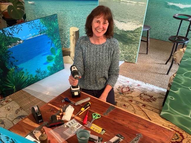 Christine Wood with paintings